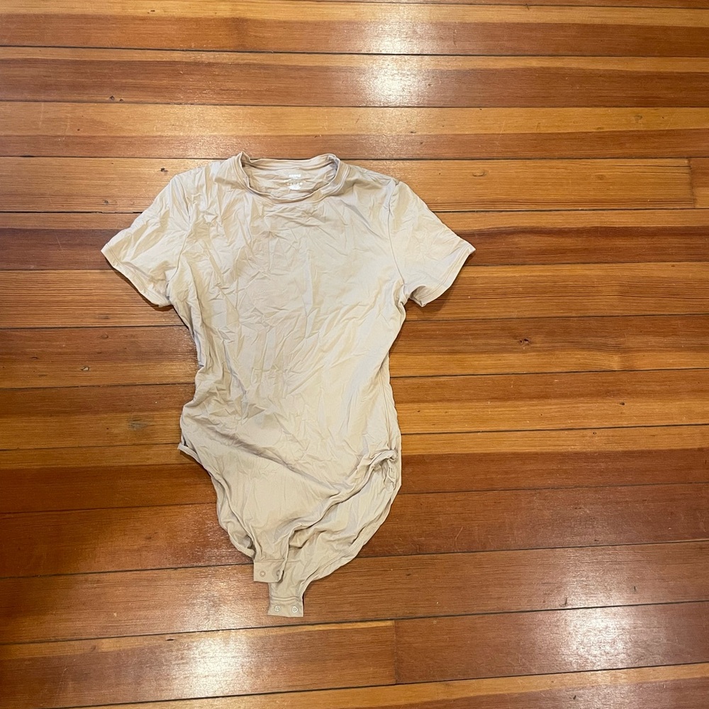 Skims cream colored bodysuit. Size large.